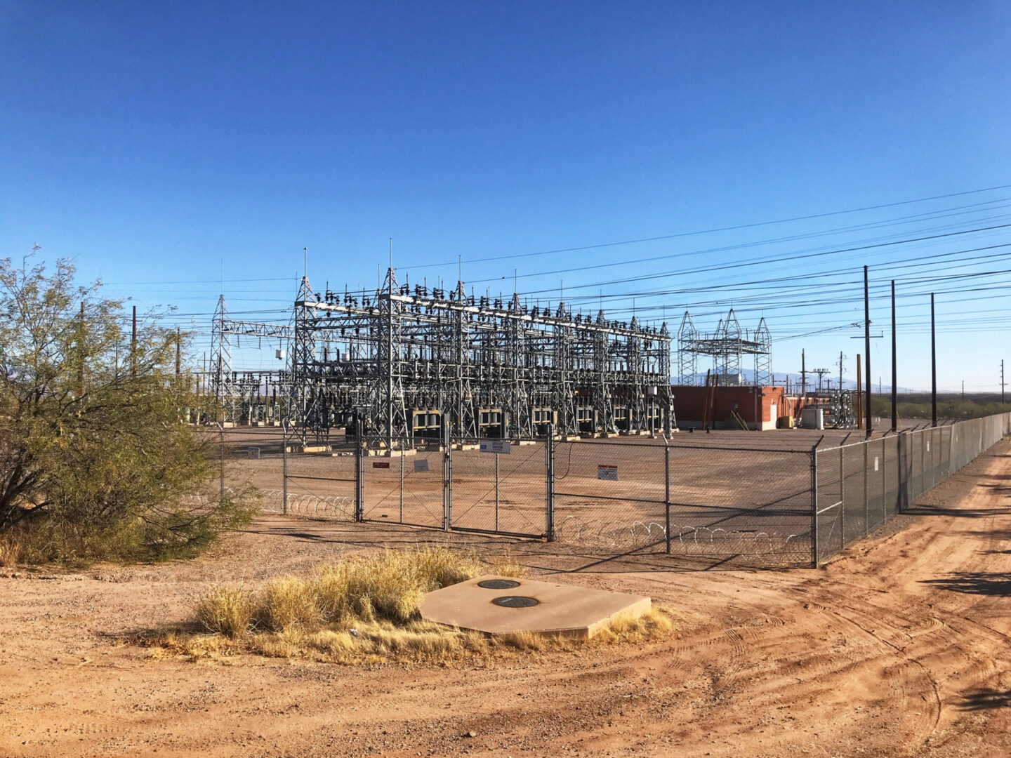 Power substation fenced in desert landscape